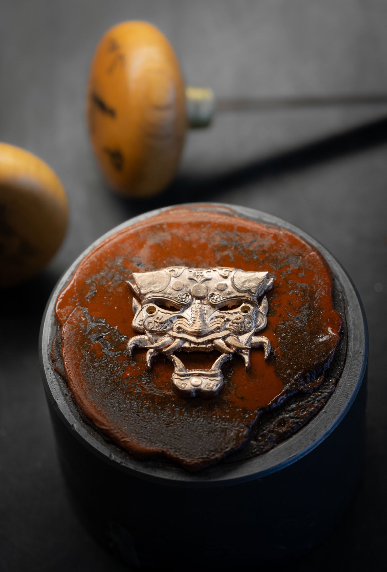 Close-up on the Bushido mask red gold engraving