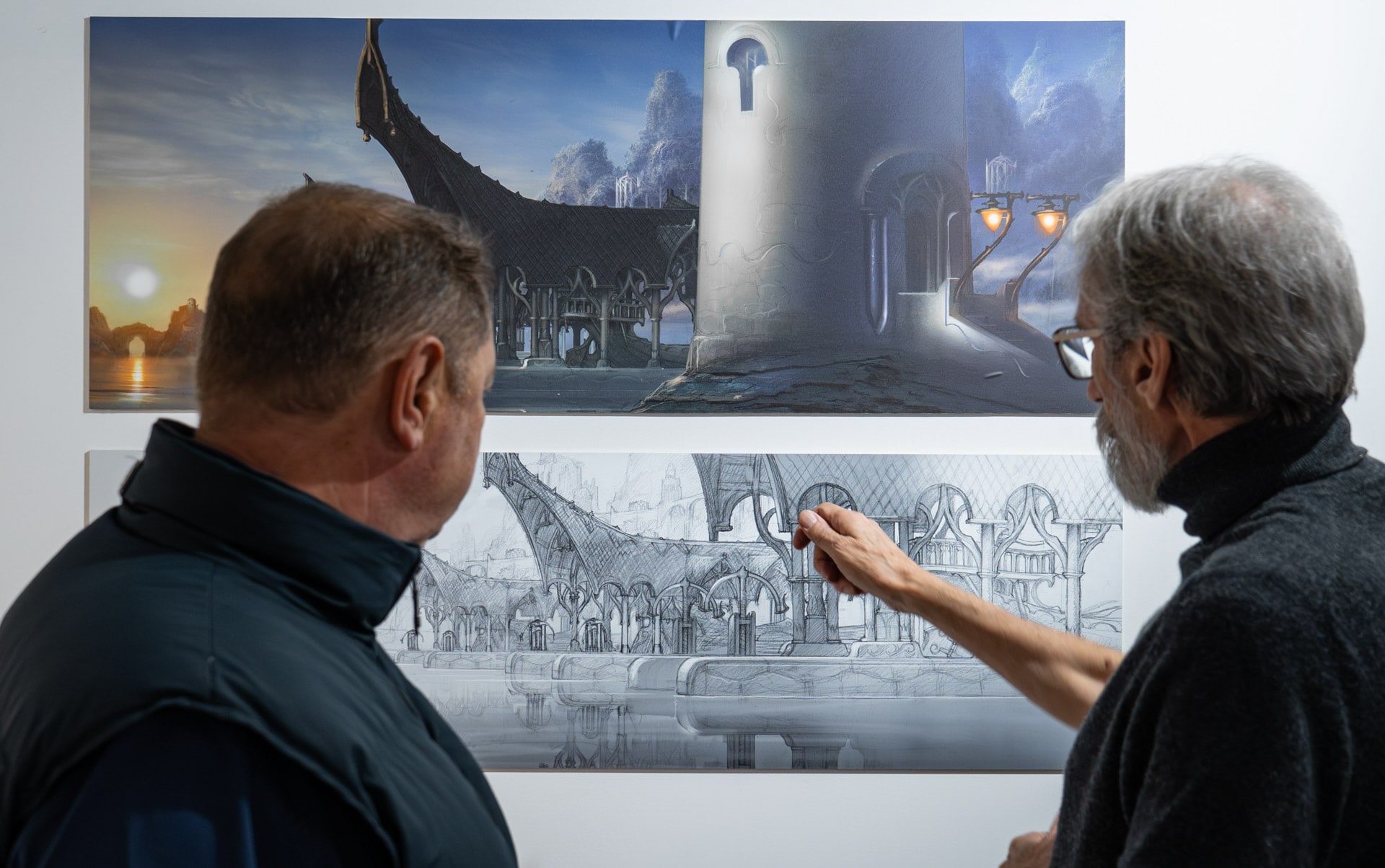 John Howe and Alain Delamuraz discussing John Howe designs in La Tour du Fantastic Exibition.