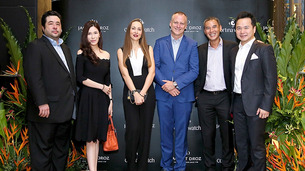 Marc Aellen and guests in front of press wall